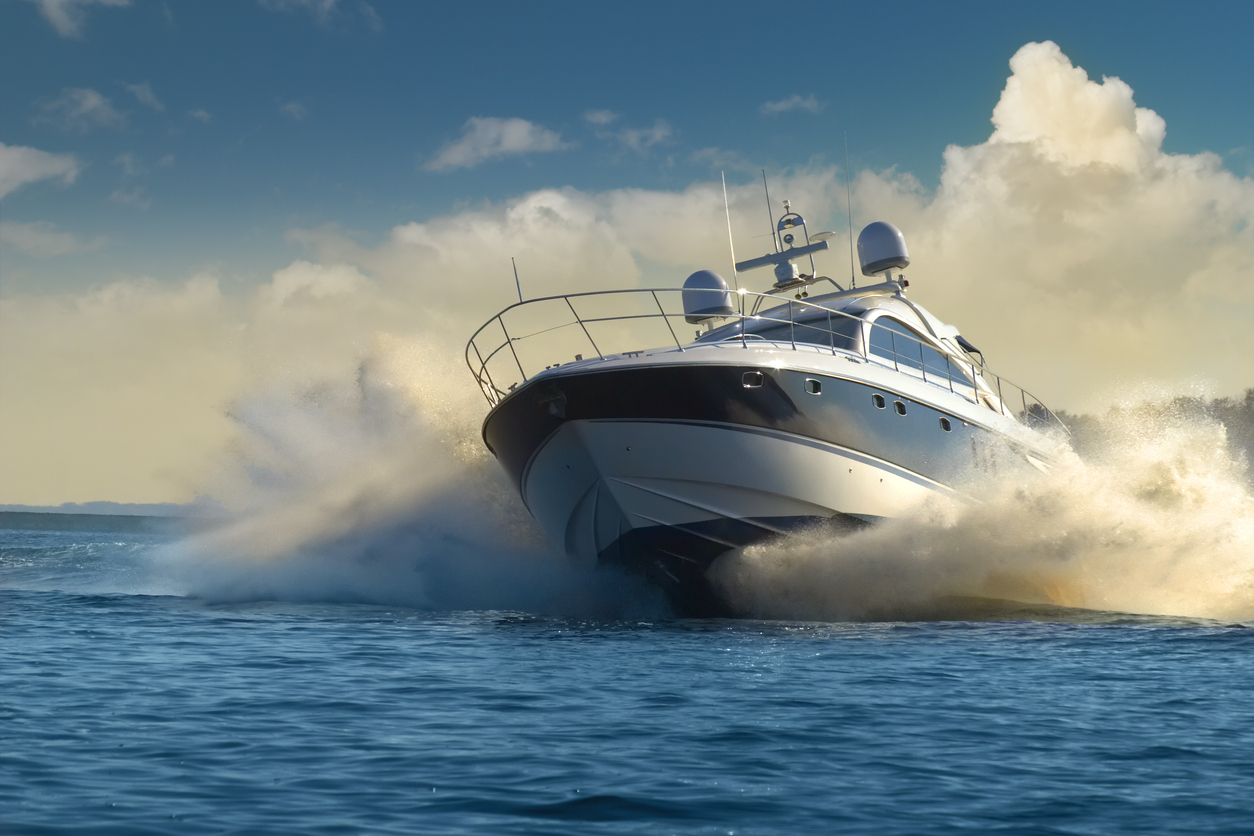 A luxury yacht in motion on the water